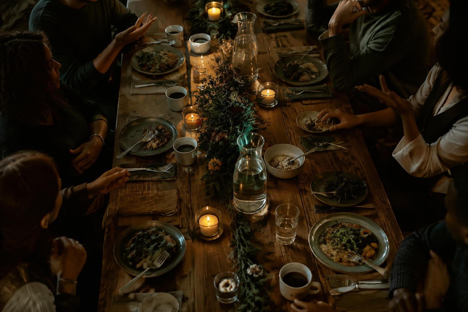 Founders around a candlelit dinner table